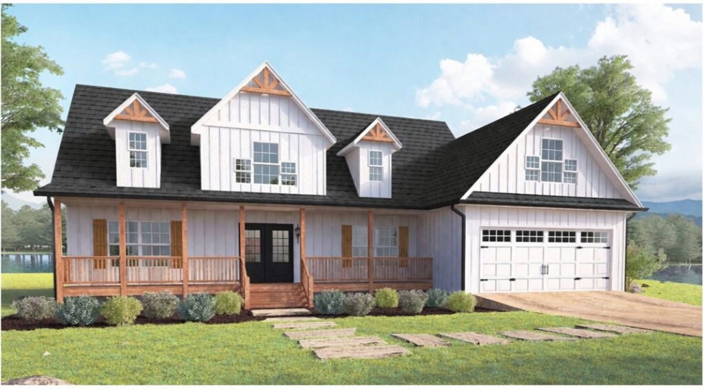 Modern farmhouse style home with white siding, black roof, and wooden porch, set in a lush green landscape.
